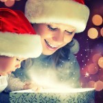 Bigstock-23346713-Christmas-Magic-Gift-Box-And-A-Happy-Family-Mother-And-Baby