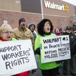 Protesters demonstrate outside a Walmart store in Chicago on Black Friday
