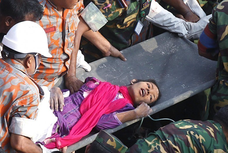 Bangladeshi rescuers retrieve garment wo