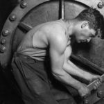 Lewis_Hine_Power_house_mechanic_working_on_steam_pump