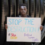 1024px-Nicholas_at_climate_protest_in_Asutria