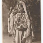 a-palestine-peasant-girl-showing-beautifully-embroidered-costume-60393f